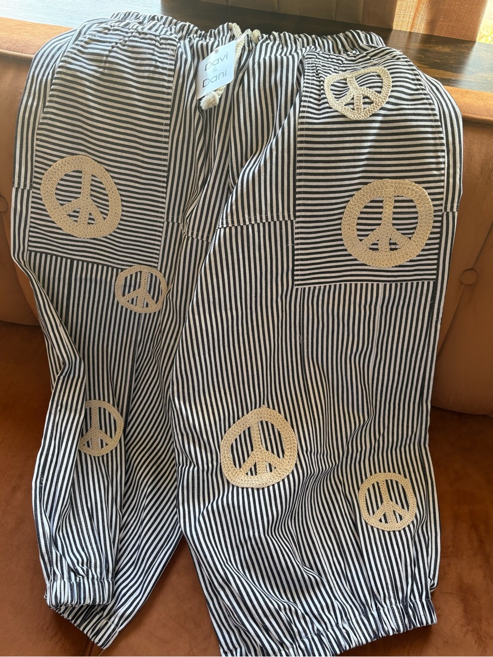 DAVI & DANI Black and White Striped Kids One-Piece with Cream Peace Signs